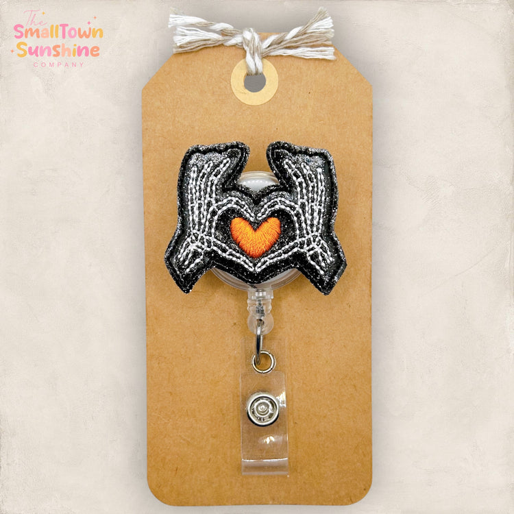 Skeleton Hands Heart Badge Topper