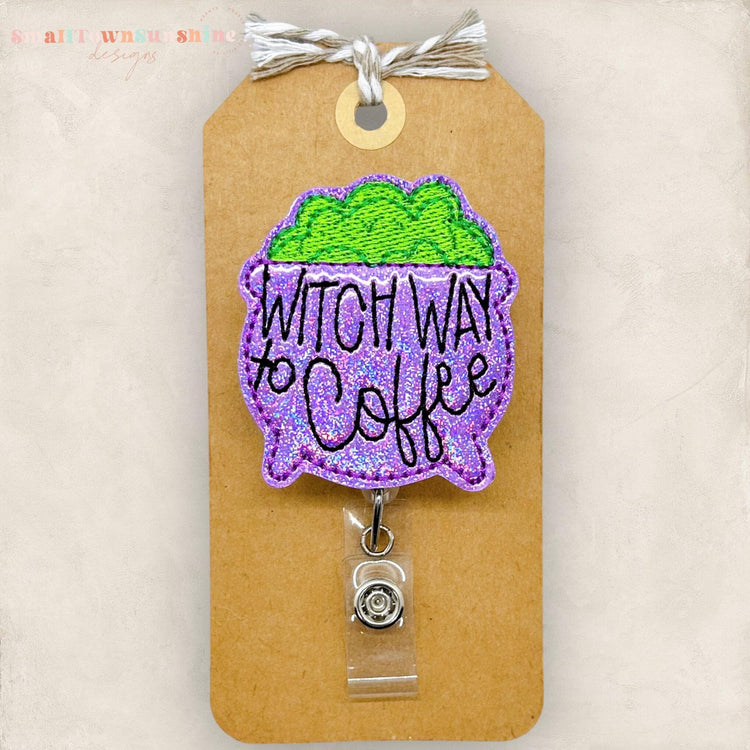 punny purple halloween cauldron embroidered badge reel