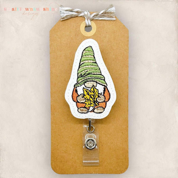 embroidered fall dressed gnome holding leaf badge reel topper