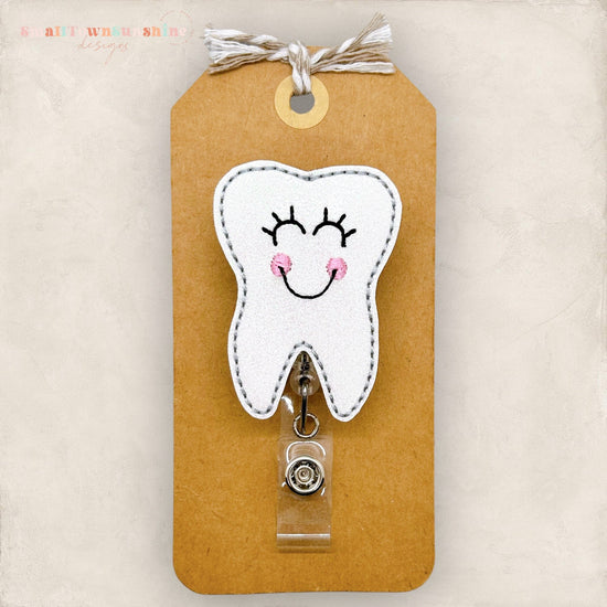 happy tooth badge reel
