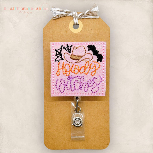 pink cowboy hat howdy witches badge reel