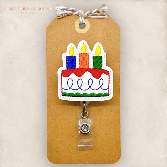 birthday cake badge reel, no glitter primary color cake for men