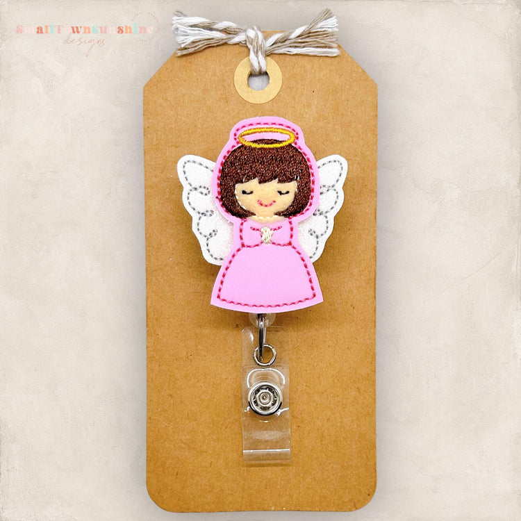 brown haired angel with pink dress with wings and halo embroidered badge reel
