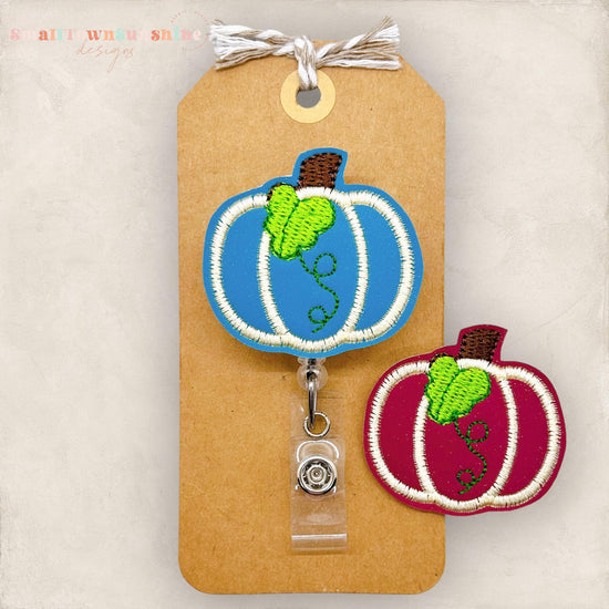 embroidered pumpkin with leaf for badge reels in teal or burgundy