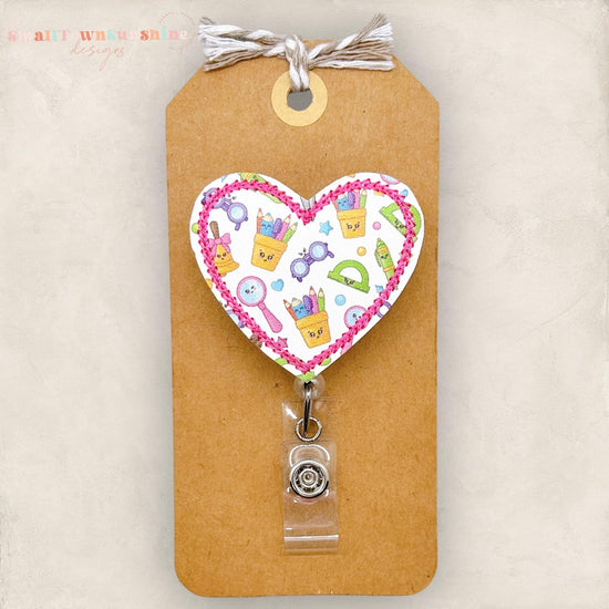 school supplies badge reel, pencil cup, ruler, school bell, magnifying glass, markers