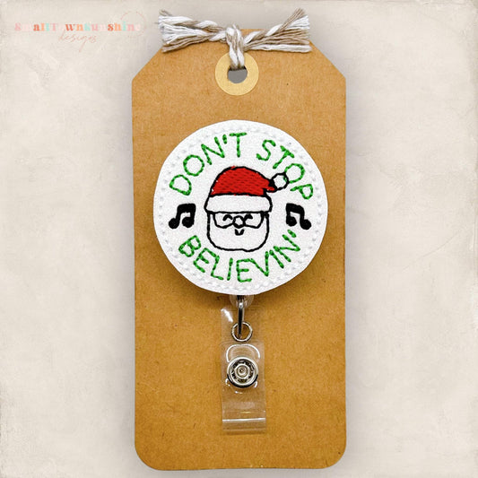 don't stop believing in santa embroidered badge reel