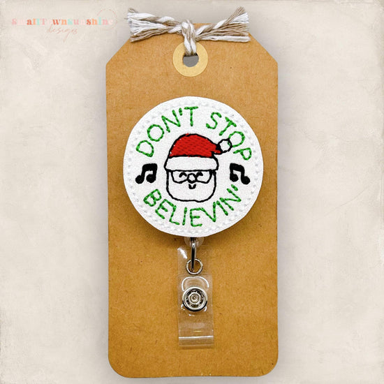 don't stop believing in santa embroidered badge reel