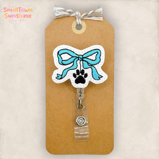 Blue Paw Print Bow Retractable Badge Reel: ID Holder, Name Tag, Swappable Topper, Coworker Gift, Lanyard, MRI Safe, Heavy Duty | GLITTER